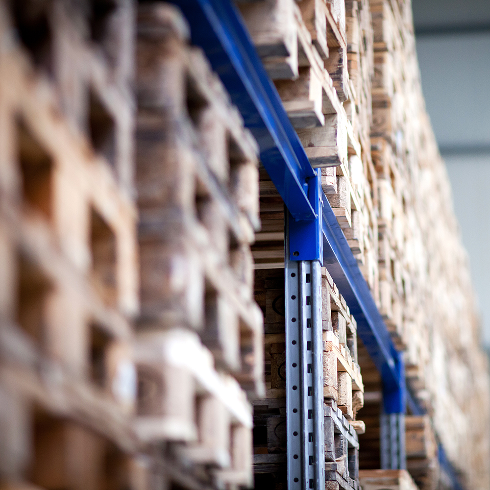 Pallets stacked on warehouse shelves